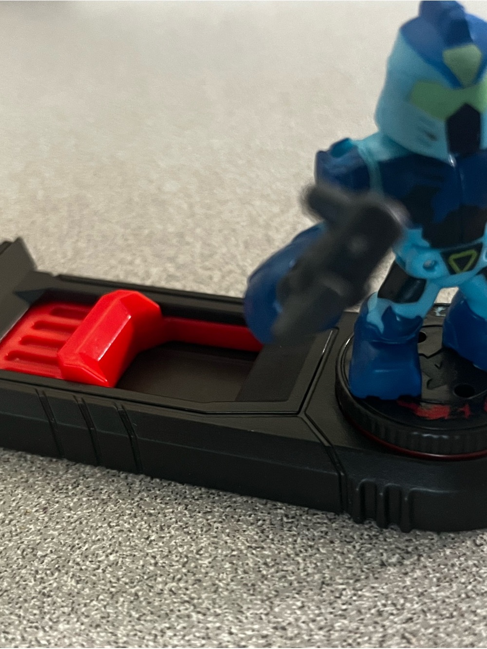 Blue Action Figure Playset with Black Base and Red Accent